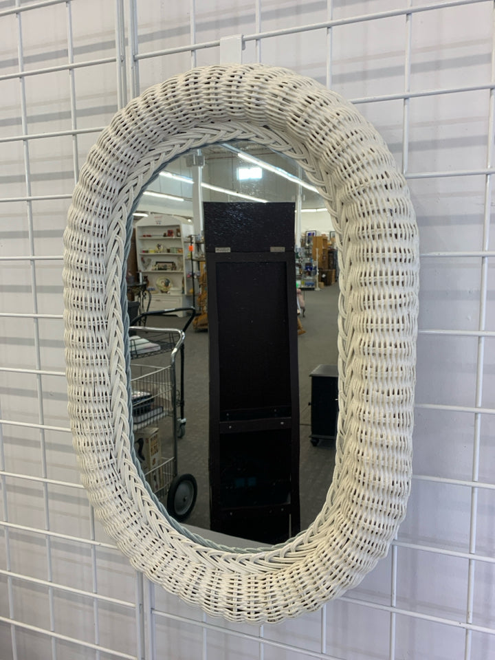 WHITE WICKER OVAL WALL MIRROR.