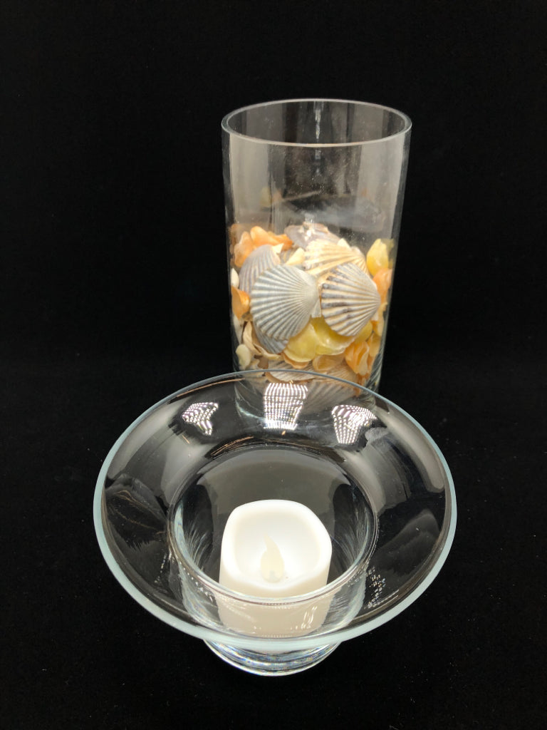 SEASHELL FILLED GLASS CANDLE HOLDER.