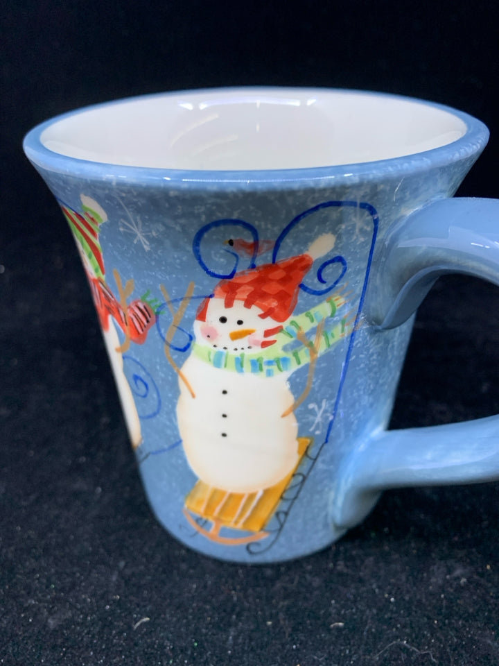SNOWMEN ON SLEDS BLUE MUG.