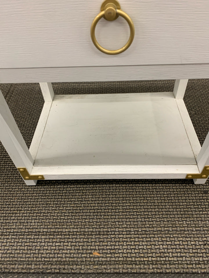 WHITE LOW TWO TIER SIDE TABLE W/ GOLD HARDWARE CIRCLE HANDLES.