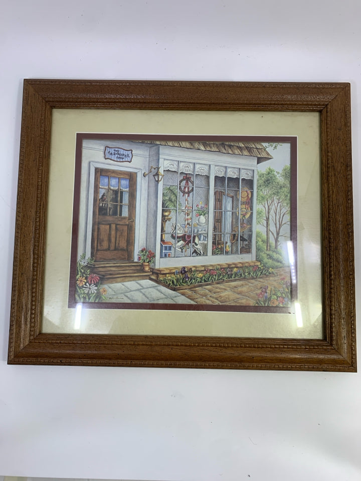 CAROUSEL SHOP PRINT IN BROWN FRAME.