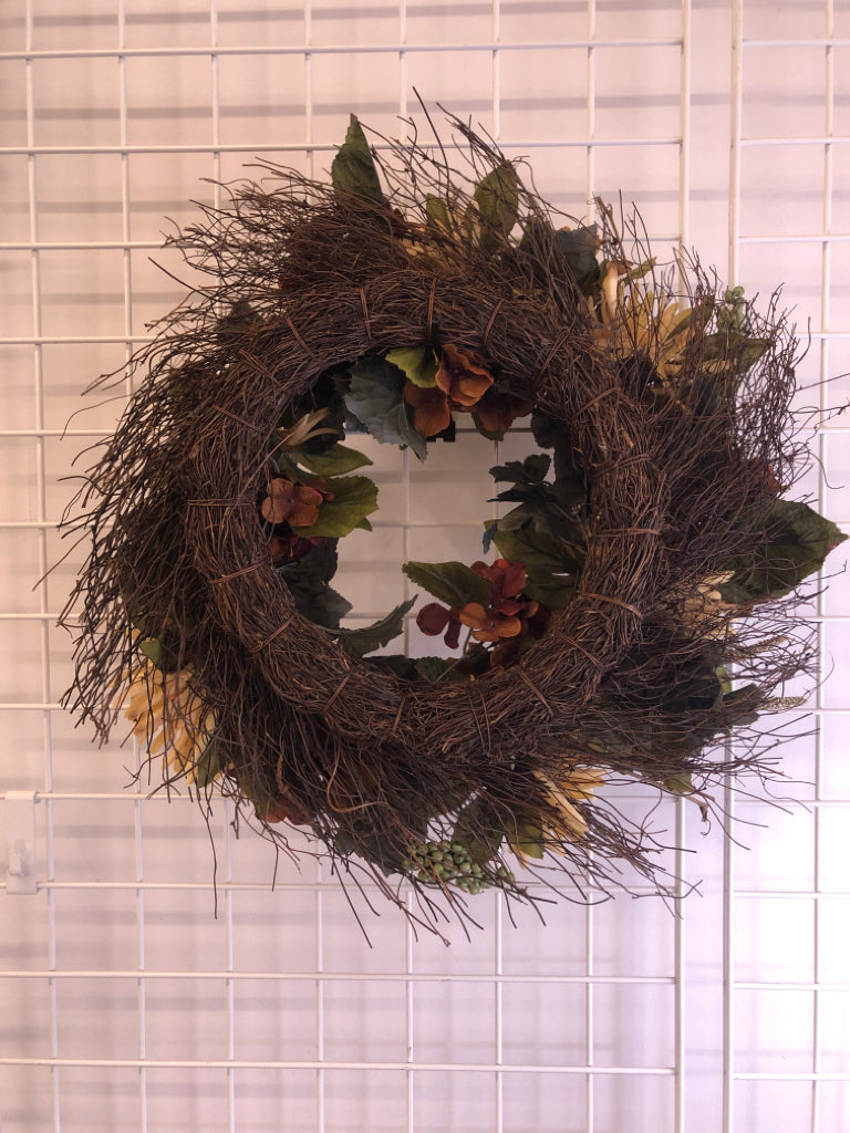 TAN/BROWN FLORAL WREATH W/GREEN LEAVES, BERRIES.