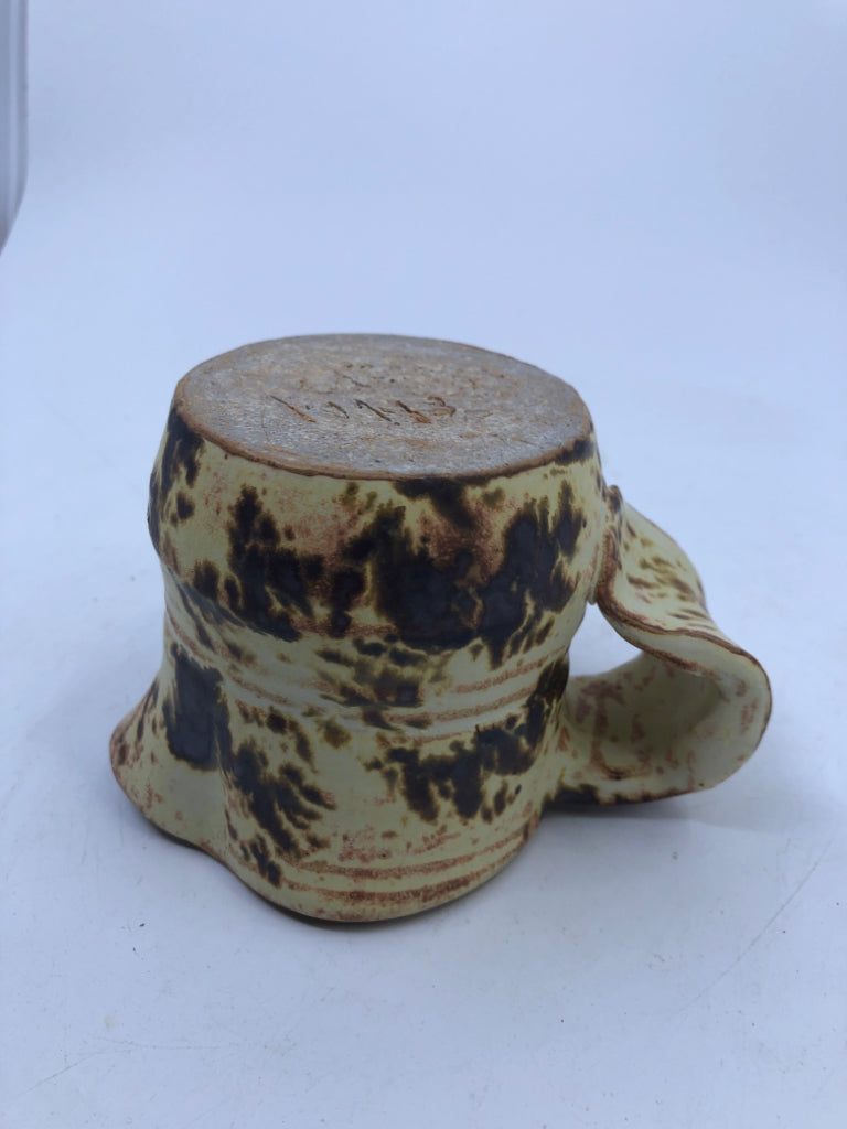 BROWN AND YELLOW COW PATTERN CREAMER.
