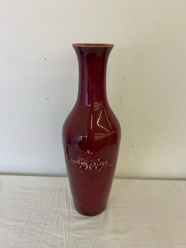 LARGE RED FLOOR VASE W EMBOSSED SCROLL DETAIL.