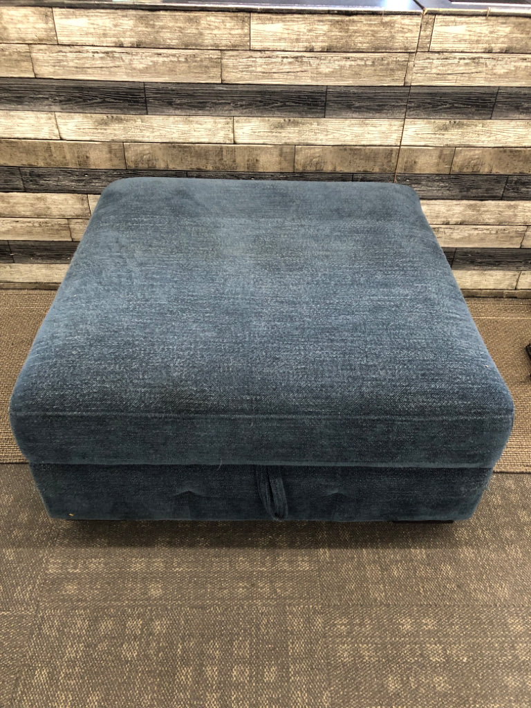 BLUE FABRIC STORAGE OTTOMAN.