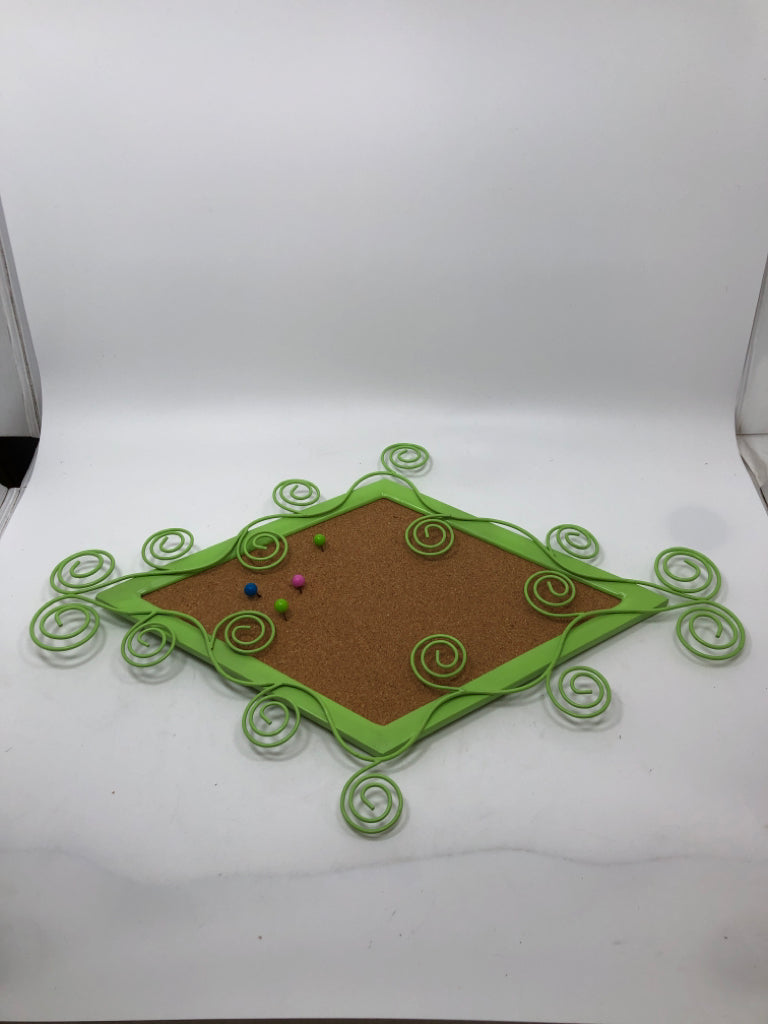 GREEN METAL SCROLL CORK BOARD.
