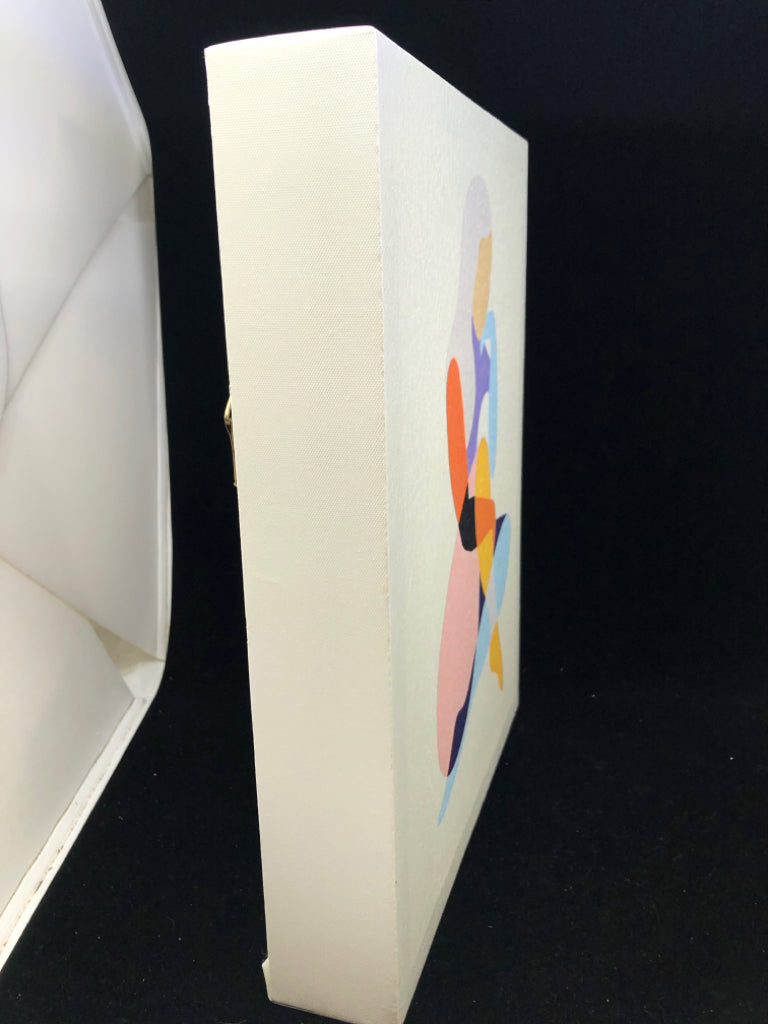 COLORFUL GIRL SITTING CANVAS WALL ART.