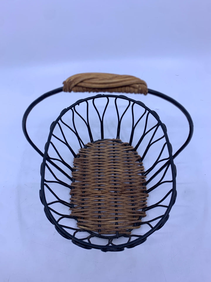 BLACK METAL BASKET W WOVEN BOTTOM AND HANDLE.