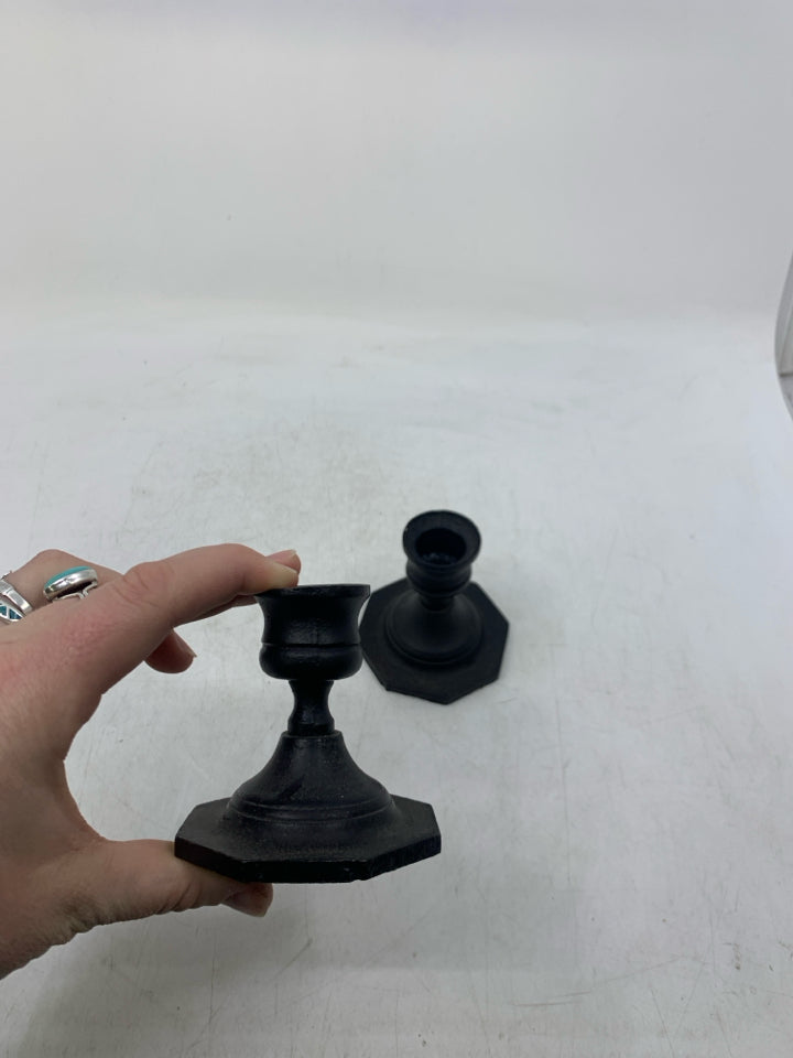 2 BLACK METAL SHORT TAPERED CANDLE HOLDERS.
