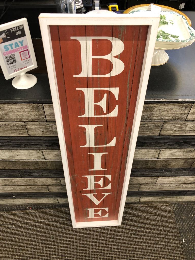 RED "BELIEVE" WALL HANGING.