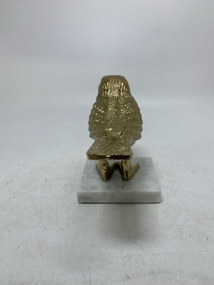 MARBLE SLAB W/ GOLD METAL BIRD DECOR.