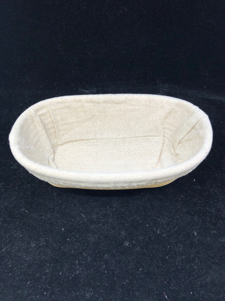 OVAL WOOD BASKET W CREAM LINER.