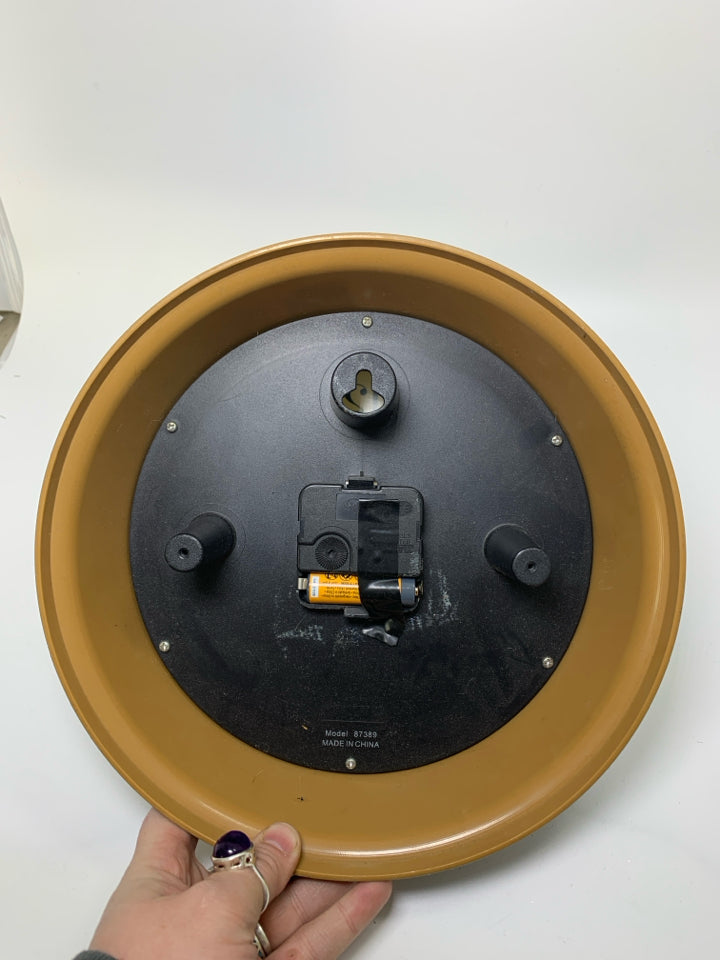 THICK BLACK PLASTIC WALL CLOCK.