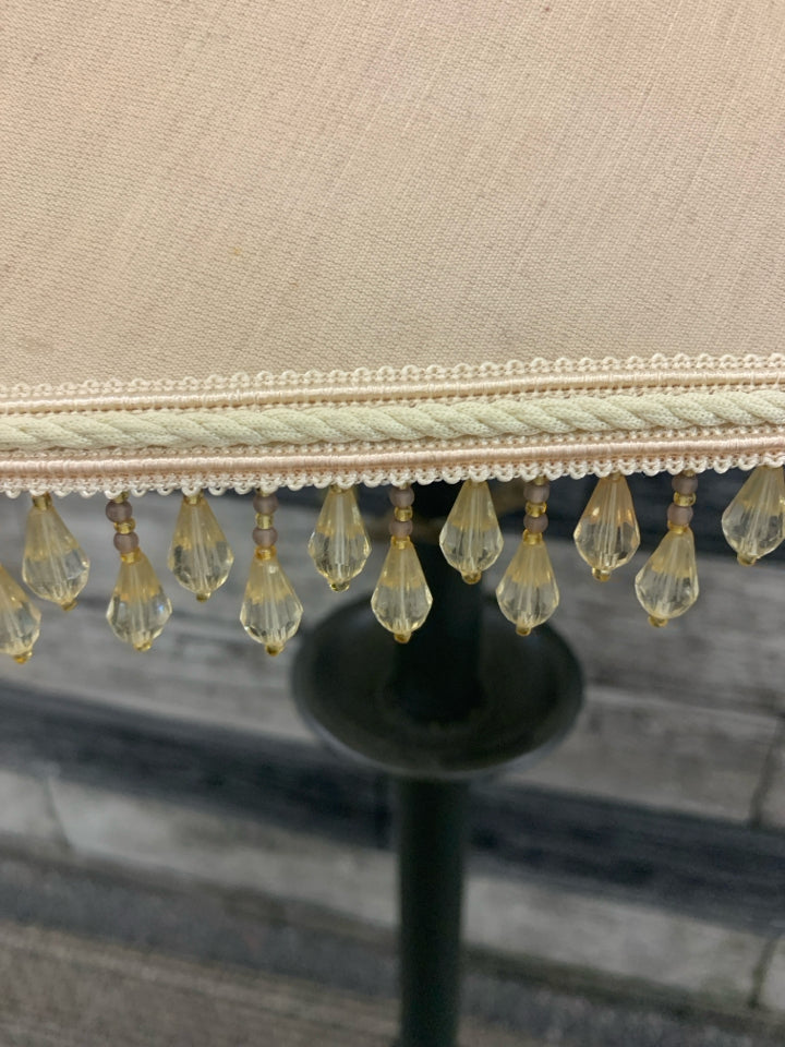 SILVER SKINNY BASE LAMP W TASSEL SHADE.