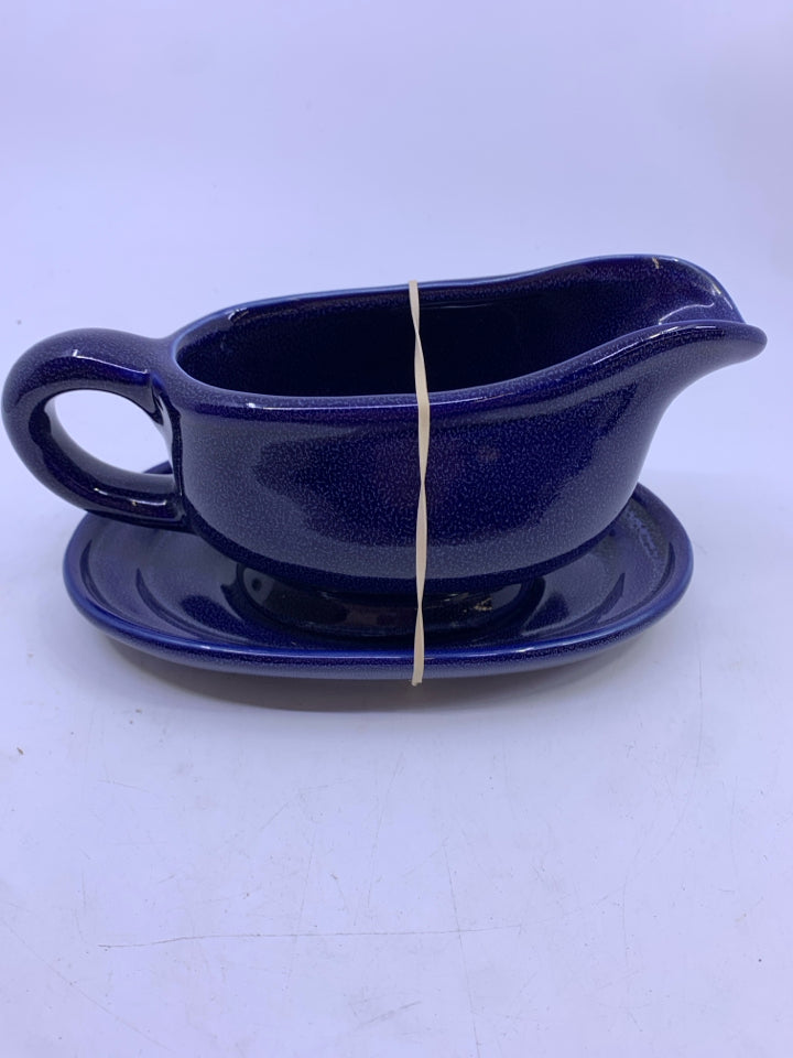 DK BLUE CERAMIC GRAVY BOAT WITH UNDERPLATE.