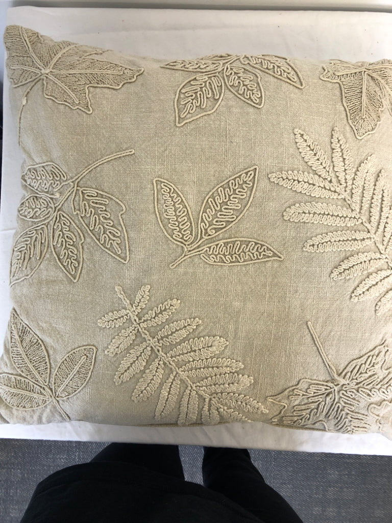 CREAM EMBOSSED LEAF PILLOW.