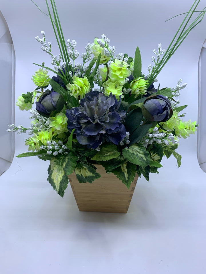 FAUX BLUE AND GREEN FLORAL IN WOOD FLARED TOP PLANTER.