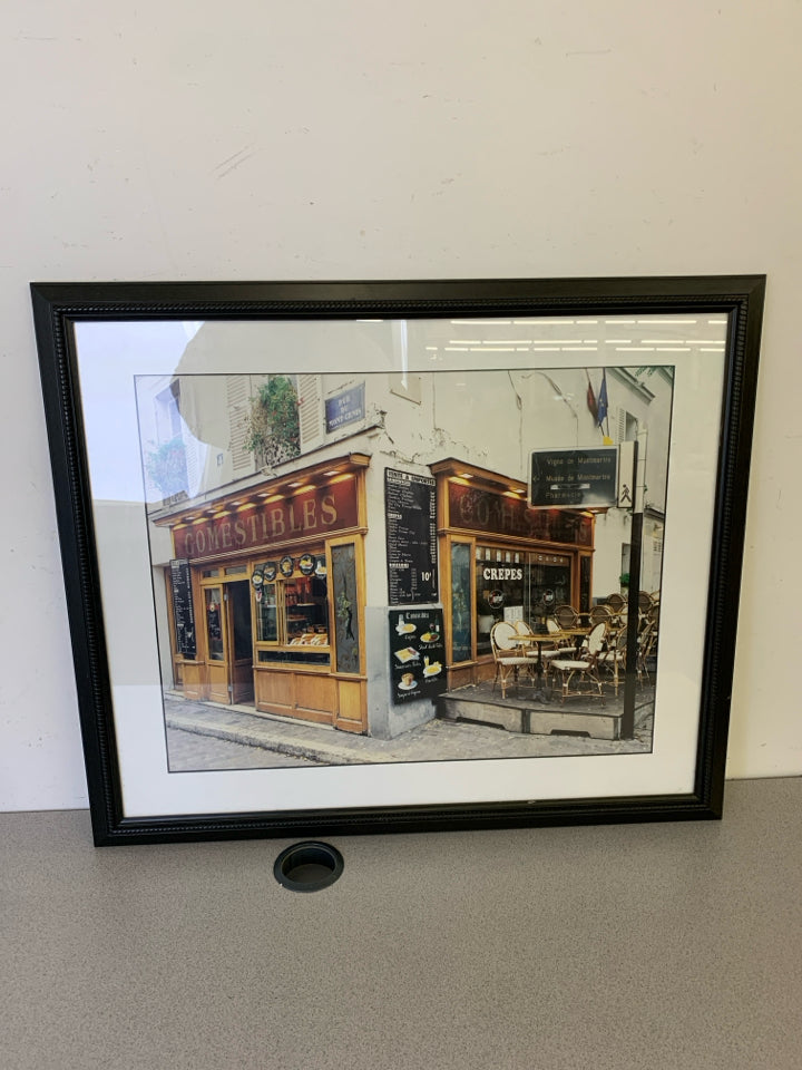 COMESTABLES CAFE FRONT IN BLACK FRAME.