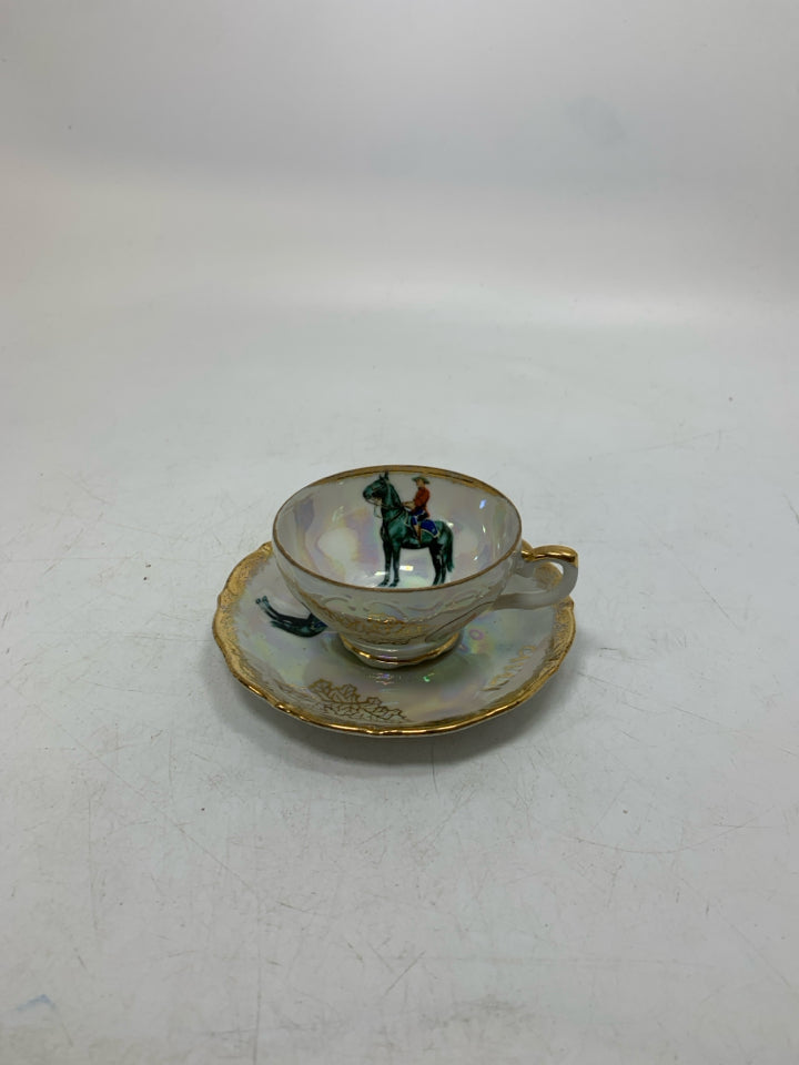 IRIDESCENT SMALL TEACUP W/ MAN RIDING HORSE.