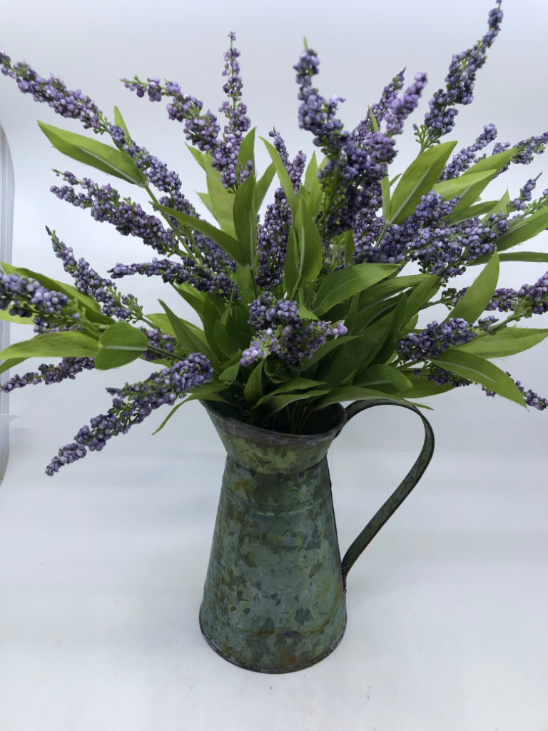 METAL PITCHER W/ FAUX PURPLE FLOWERS.