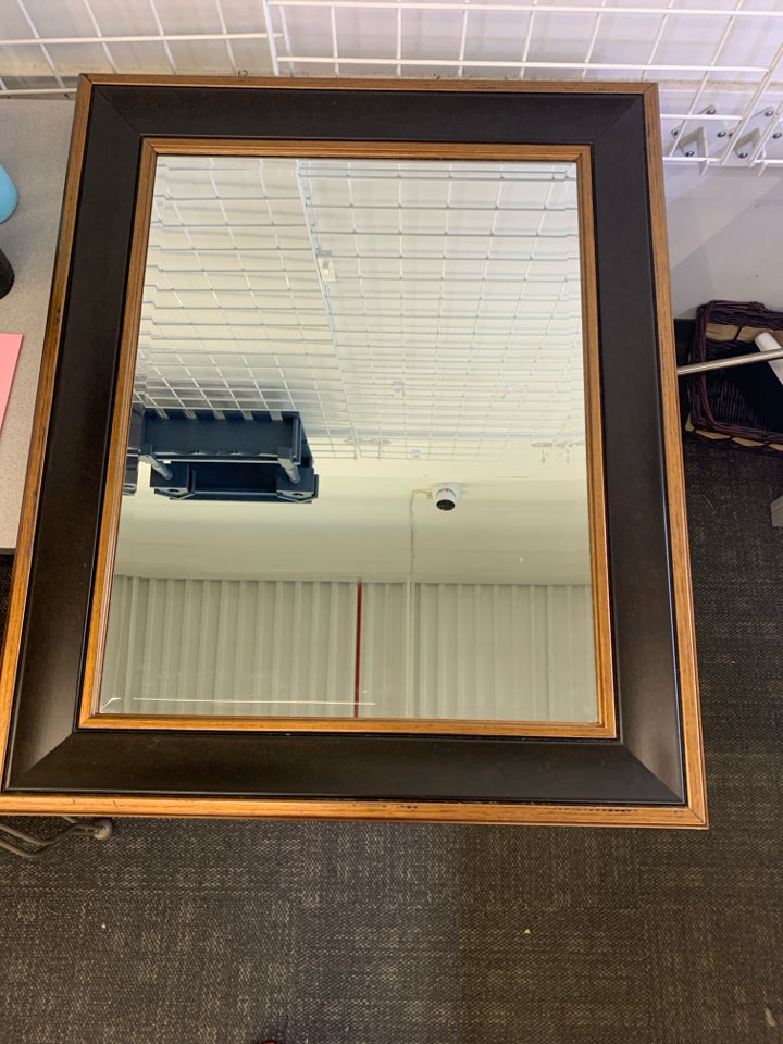 LARGE BRONZE MIRROR W BLACK FRAME.