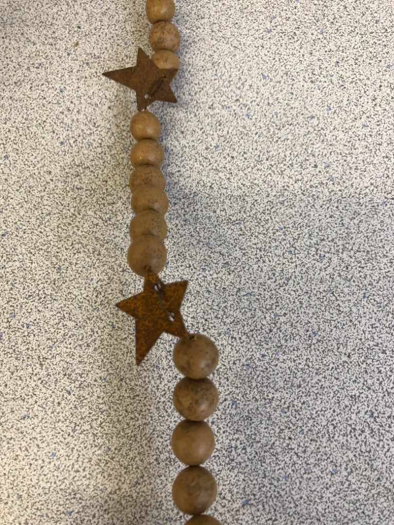 PRIMITIVE BEADED WIRE GARLAND W/BOW.