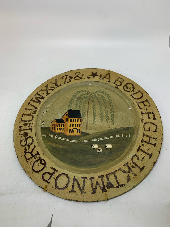 METAL CIRCLE WALL HANGING W/ YELLOW HOUSE/WEEPING WILLOW.
