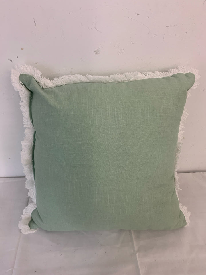 TEAL PILLOW W/ WHITE FRINGE BORDER.