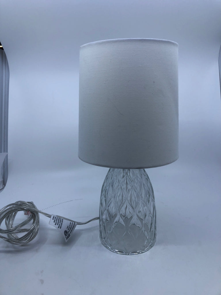 CLEAR GLASS LAMP W WHITE SHADE.