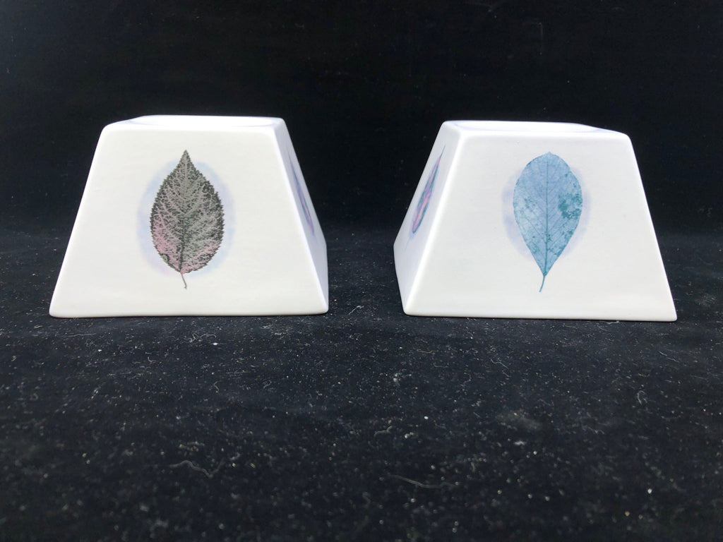 2 WHITE/ GREEN LEAVES DUSK CANDLE HOLDERS.