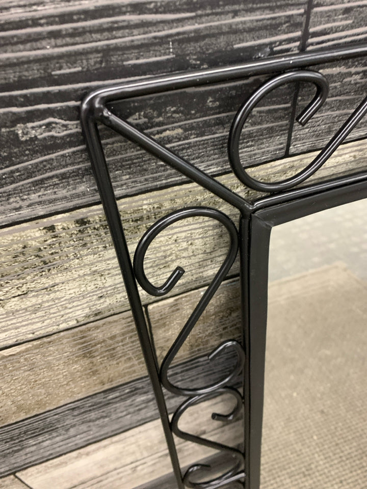 MIRROR W/ BLACK METAL FRAME WALL HANGING.