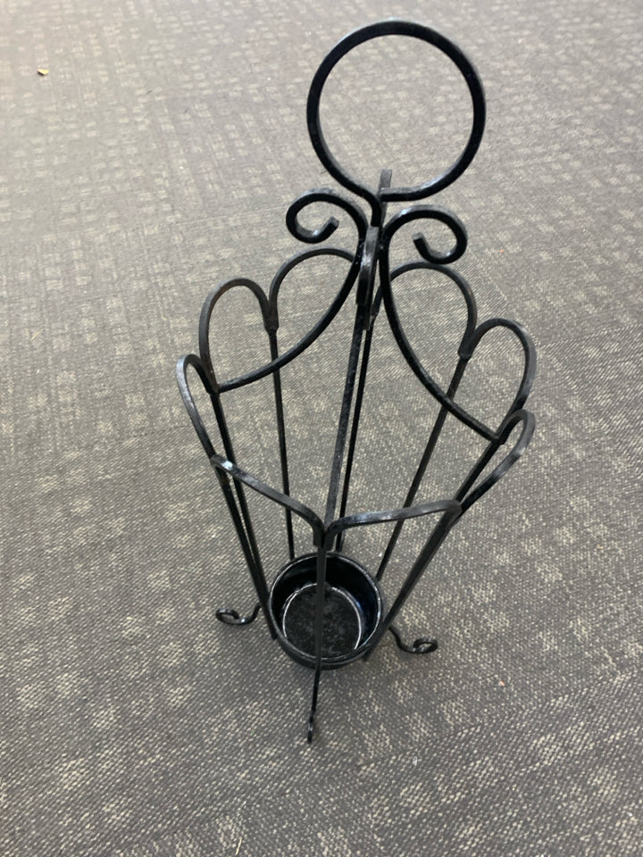METAL UMBRELLA HOLDER.