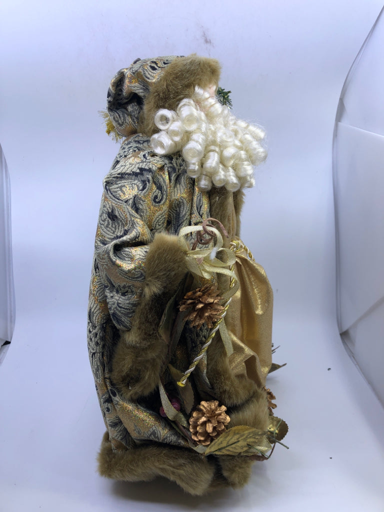 STANDING HOLLOW SANTA IN GOLD JACKET W/ PINECONES HOLDING STAKE.