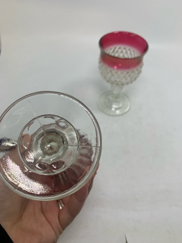 2 STUDDED SMALL WINE GLASSES W/ RED EDGES.