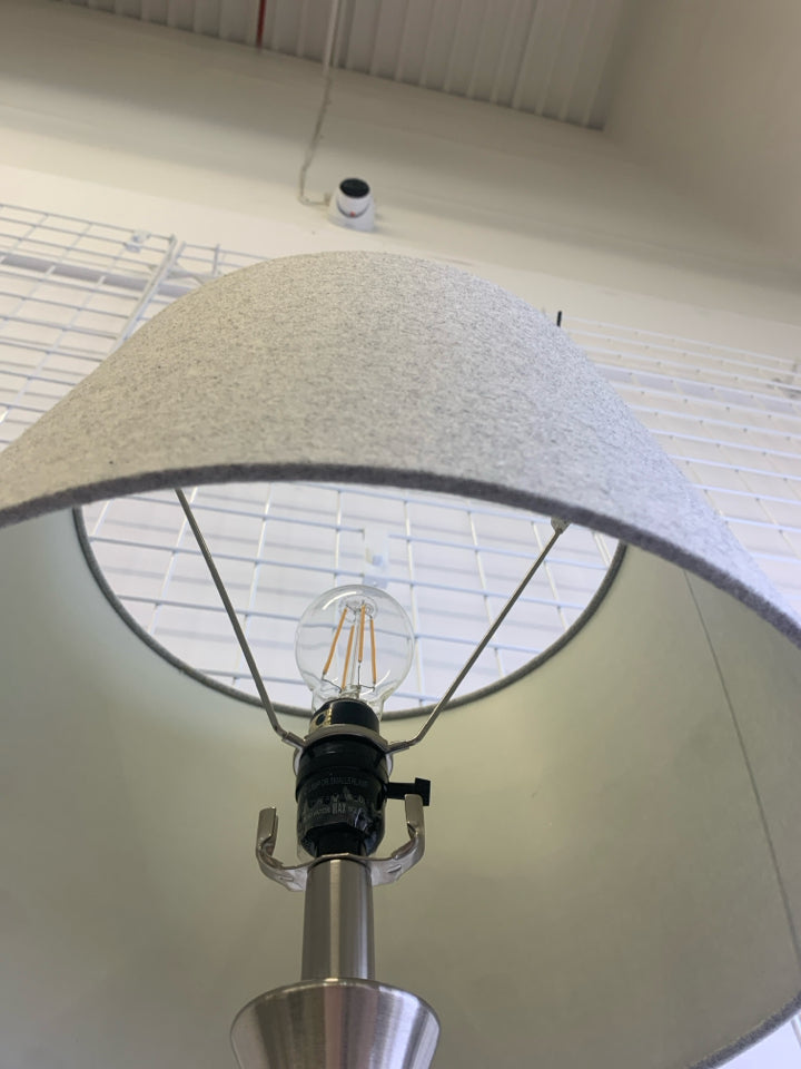 SILVER BASE LAMP W/GREY SHADE.