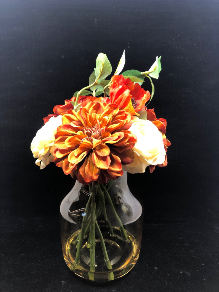 DARK ORANGE/WHITE FAUX ROSES IN YELLOW TINTED GLASS VASE.