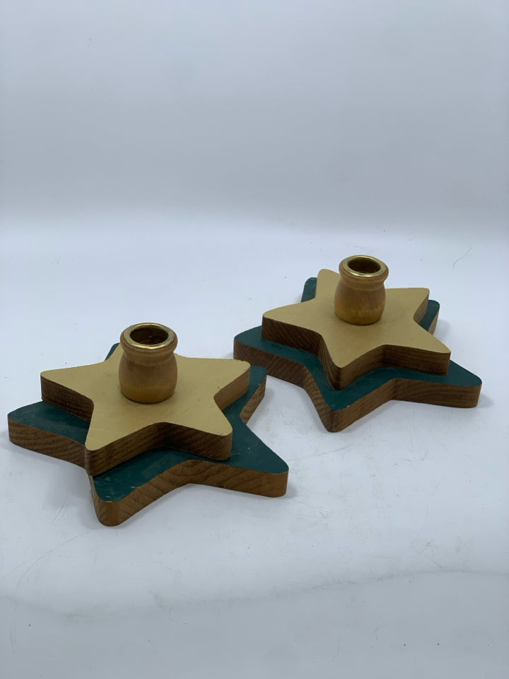 2 WOOD GREEN/GOLD STAR CANDLESTICK HOLDERS.
