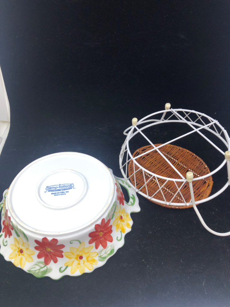 ROUND CASSEROLE DISH IN WHITE METAL STAND.