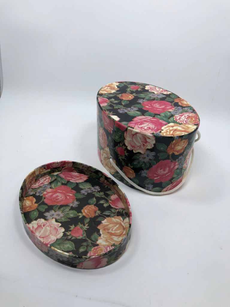 OVAL FLORAL GIFT BOX W/WHITE ROPE HANDLE.