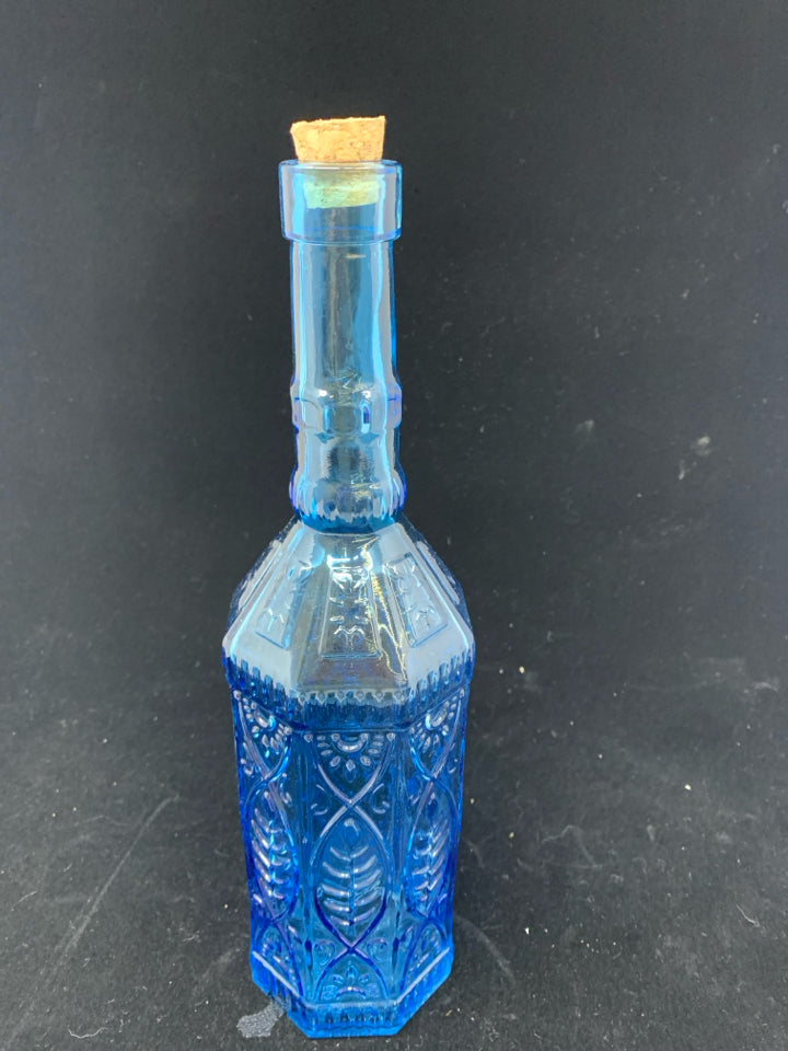 SMALL DECORATIVE BLUE GLASS BOTTLE W/CORK STOPPER.