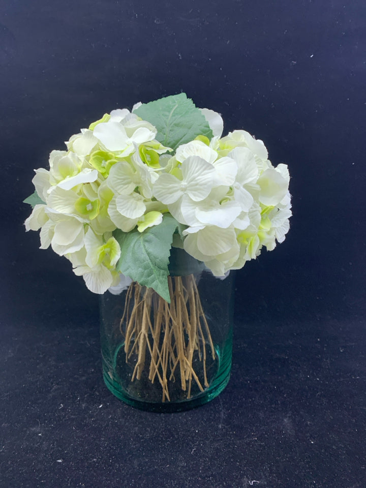 CYLINDER GLASS VASE W/WHITE FLOWERS.