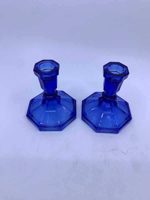 2 BLUE GLASS TAPER CANDLE HOLDERS.