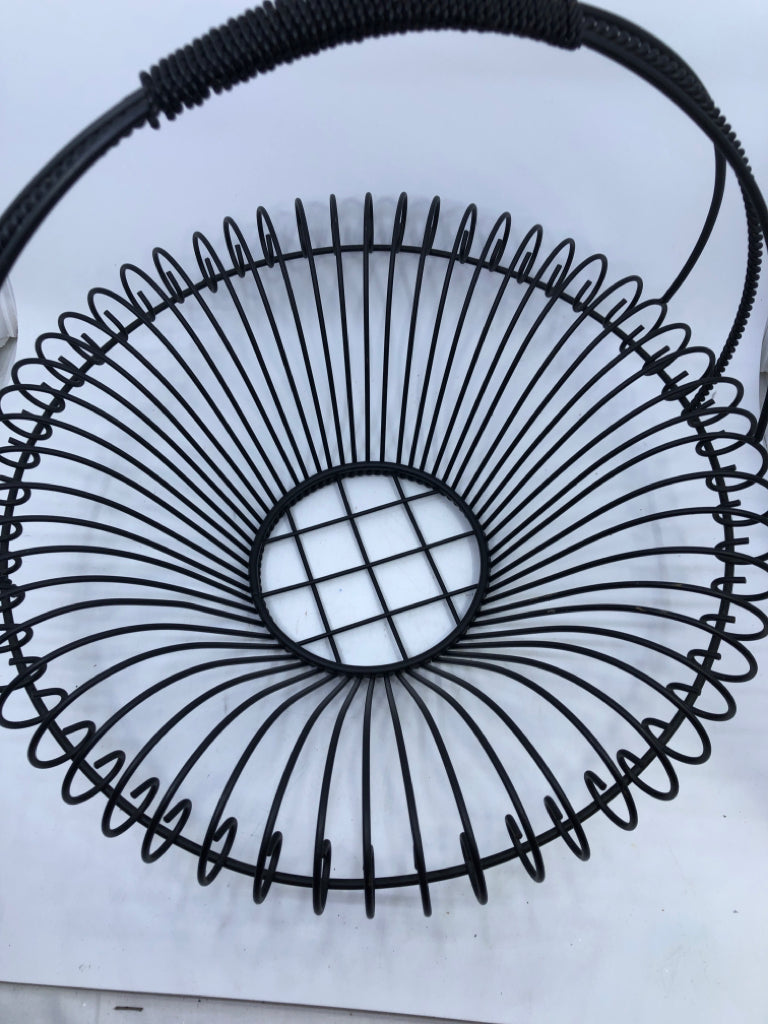 LARGE BLACK WIRE BASKET W/ HANDLE OVER HANG EDGE.