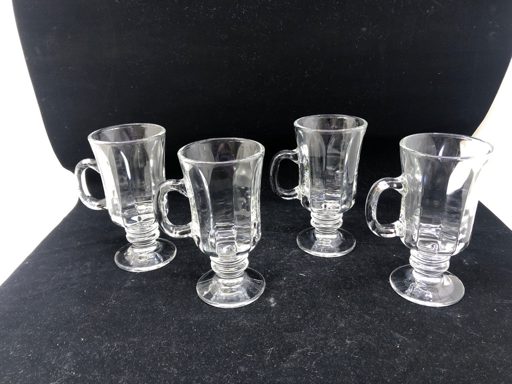 4 RIBBED FOOTED MUGS.