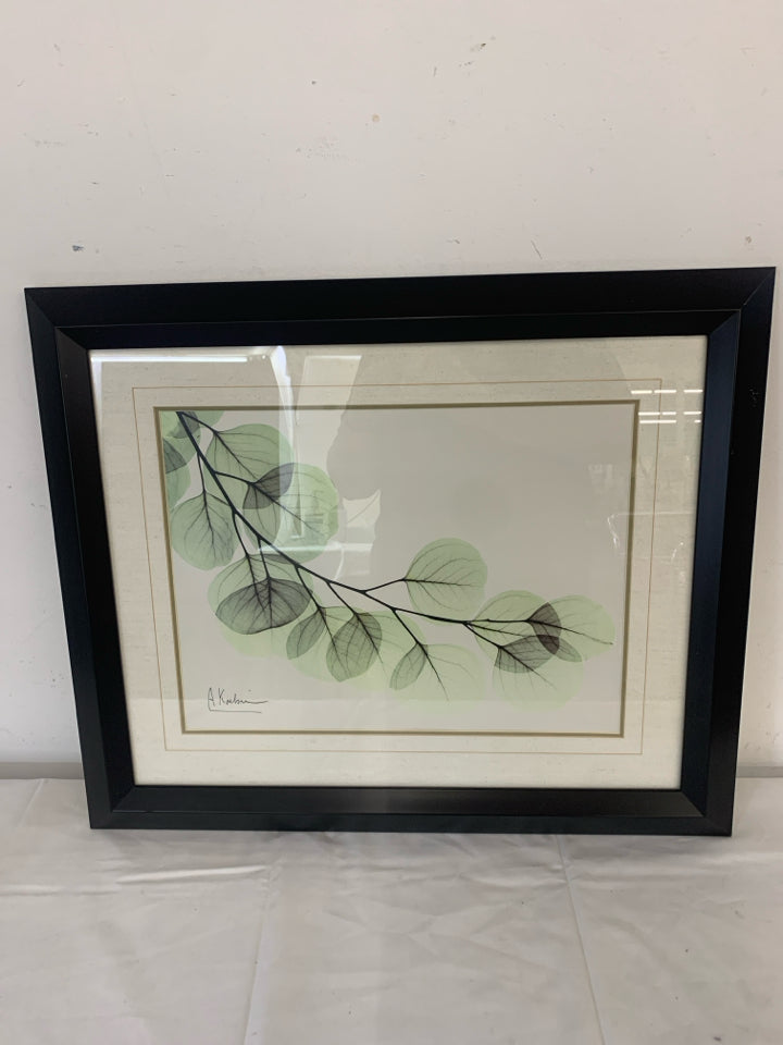 GREEN LEAVES PRINT IN BLACK FRAME.