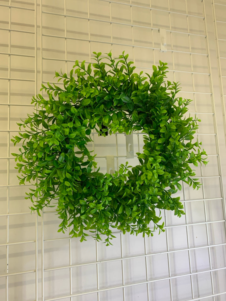 PLASTIC GREENS WREATH.