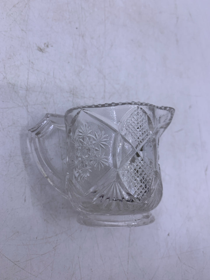 GLASS PITCHER W/ EMBOSSED STAR BURST TOOTH PICK HOLDER.