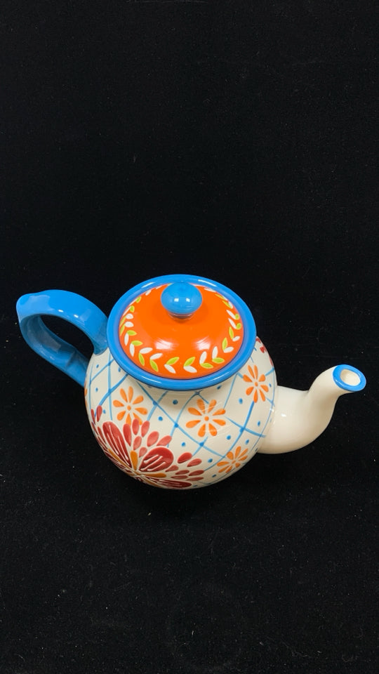 COLORFUL FLORAL TEAPOT W/BLUE HANDLE.
