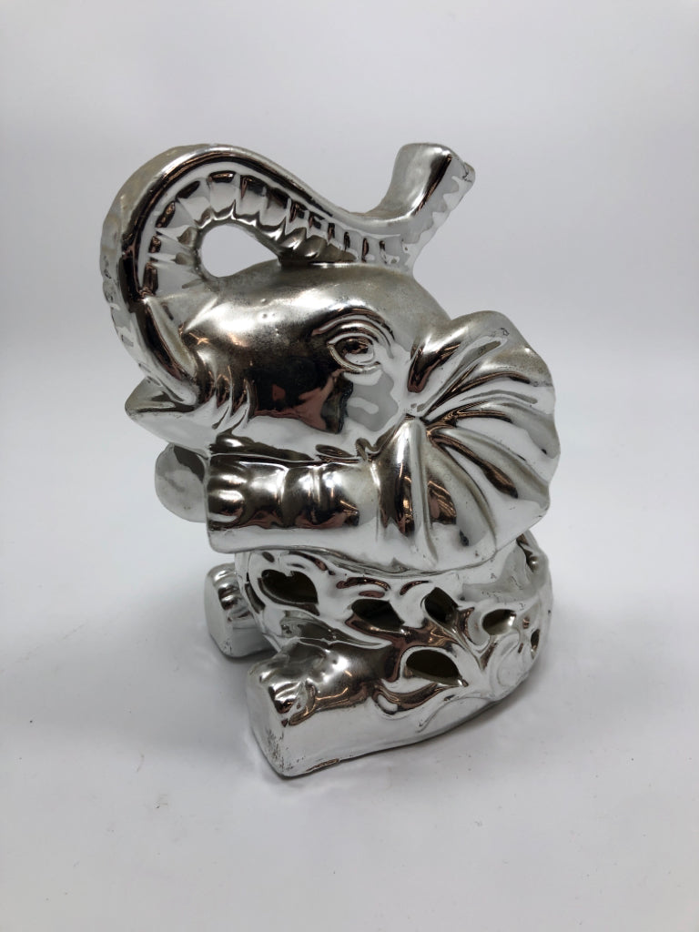 SILVER COLOR CERAMIC SITTING ELEPHANT.