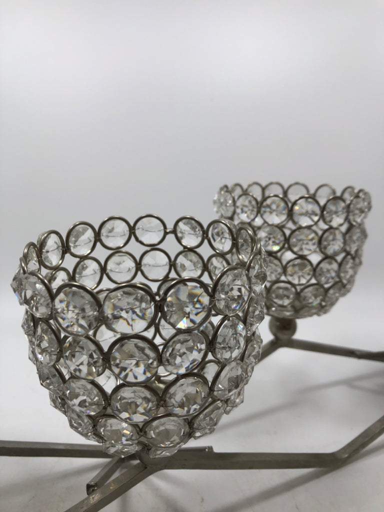 SILVER METAL AND CLEAR BEADED VOTIVE CANDLE HOLDER.